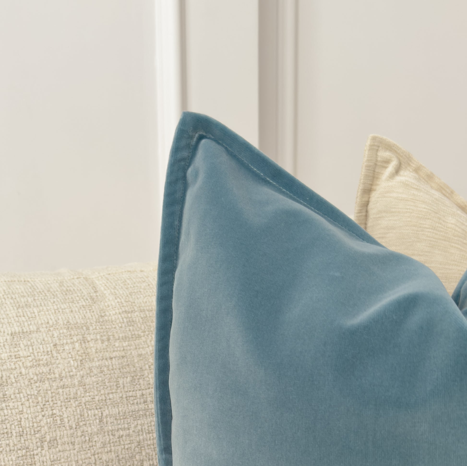 a close up of a pillow on a couch