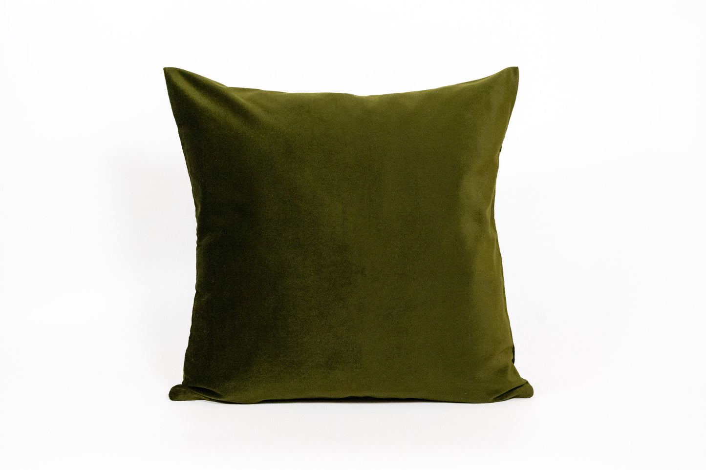 Green pillow on a white background