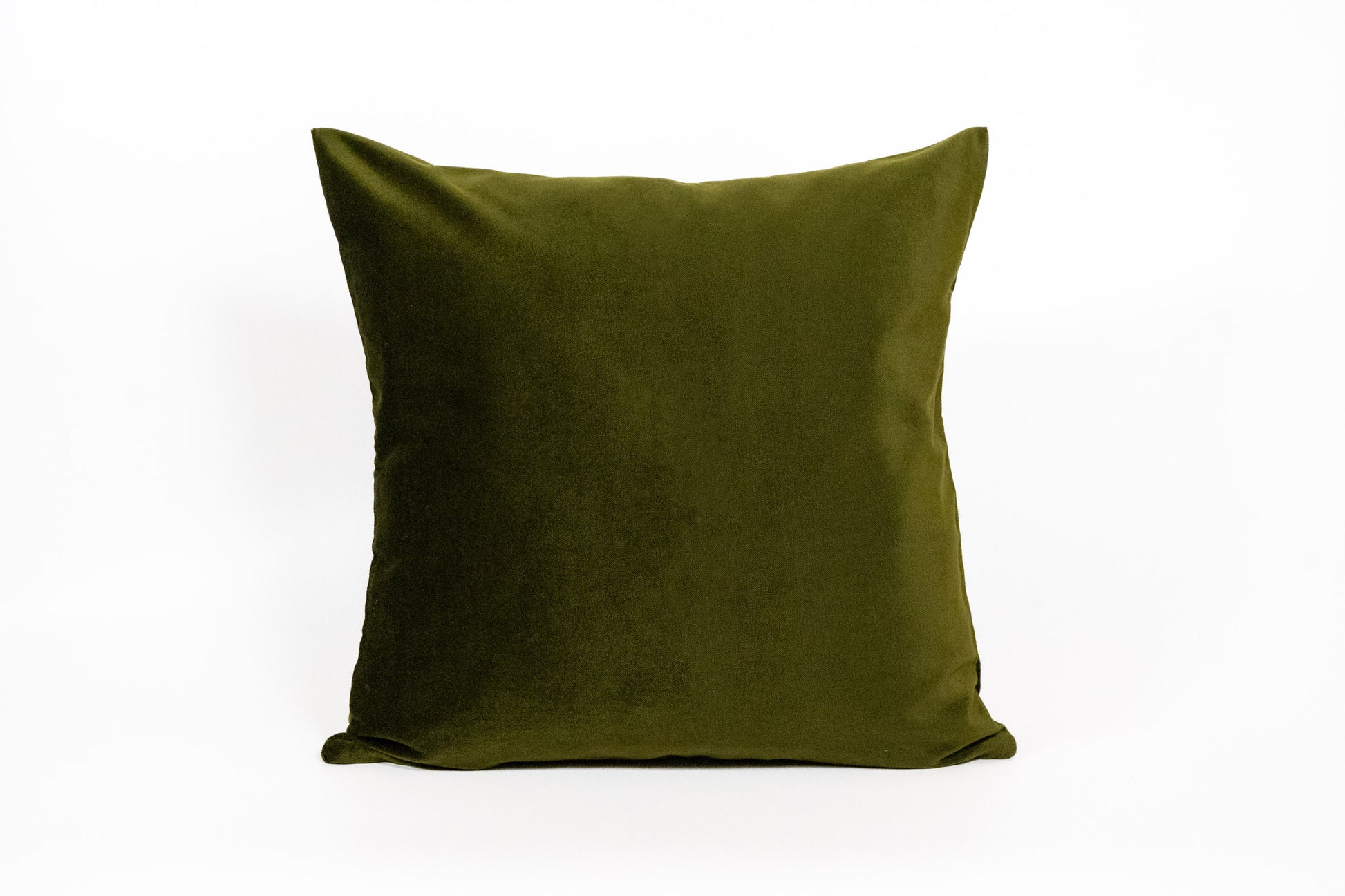 Green pillow on a white background
