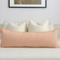Dusty pink linen extra long lumbar cushion cover on white bed