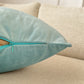 a pillow with a zipper on it sitting on a couch